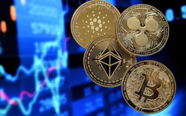epa08951657 Illustration of cryptocurrencies such as Bitcoin (bottom-R), Ethereum (C), Ripple (R) and Cardano (L) on a monitor showing a stock barometer, Duesseldorf, Germany, 20 January 2021. Cryptocurrency Bitcoin has experienced drastic ups and downs in recent weeks and months. At times, its price has increased more than fivefold over the course of the year. The price has risen particularly sharply, by more than 100 per cent since mid-December 2020. However, Internet currencies, of which there are now thousands, are known for their extreme price fluctuations. Regulators, such as the German Bafin recently, therefore repeatedly warn against investing in cryptocurrencies. Recently, the president of the European Central Bank, Christine Lagarde, called for stricter regulation of Bitcoin.  EPA/SASCHA STEINBACH