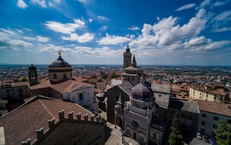 Panoramic aerial view from the tower Campanone with the churches Basilica of Santa Maria Maggiore, Bergamo Cathedral and Colleoni Chapel.