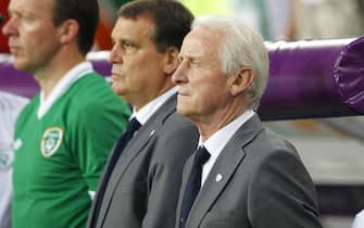 epa03271850 Ireland's head coach Giovanni Trapattoni (R) listens to the national anthems before the Group C preliminary round match of the UEFA EURO 2012 between Italy and Ireland in Poznan, Poland, 18 June 2012.  EPA/ADAM CIERESZKO UEFA Terms and Conditions apply http://www.epa.eu/downloads/UEFA-EURO2012-TCS.pdf