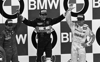 Ayrton Senna (BRA) Lotus celebrates his maiden Grand Prix win on the podium with second placed Michelle Alboreto (ITA) Ferrari and third placed Patrick Tambay (FRA) Renault.
Formula One World Championship, Rd2, Portuguese Grand Prix, Estoril, Portugal, 21 April 1985.
