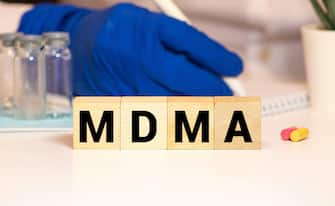 cubes with the word MDMA on them. Care concept