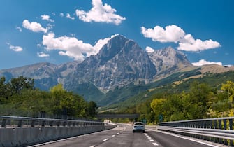 An highway in Italy; the mountain Gran Sasso in background