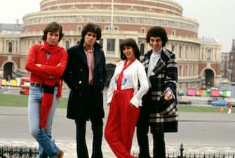 84904475 UNITED KINGDOM - JANUARY 01: Photo of Gali ATARI and MILK & HONEY; Posed group portrait of Israel's Eurovision song contest winners outside the Royal Albert Hall with Gali Atari (2nd right) (Photo by Fin Costello/Redferns)