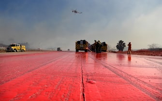 Los Angeles SIMI VALLEY, CALIFORNIA OCTOBER 30, 2019-Phos-Chek covers the Southbound 23 Freeway as firefighters make a stand and prevent the Easy Fire burns in Moorpark Wednesday.