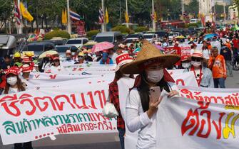 epa11311652 Thousands of Thai and migrant workers attend a demonstration and march along a road to mark International Labor Day 2024, in Bangkok, Thailand, 01 May 2024. Thousands of various groups of Thai and migrant workers took part in a rally on Labor Day for better welfare as well as better minimum wage and equal rights for migrant workers.  EPA/NARONG SANGNAK