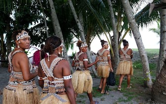 SYDNEY, AUSTRALIA - OCTOBER 11: The female traditional dance group 'Faeni' who are part of the Solomon Islands Cultural Group arrive for rehearsal at Ginger Beach  ahead of going to Australia for the Royal Edinburgh Military Tattoo on October 11, 2019 in Honiara, Solomon Islands. The Australian Defence Force is picking up performers from the Pacific Islands to travel to Sydney to participate in the Royal Edinburgh Military Tattoo. The Sydney production will be the largest Tattoo in its 69-year history with 1521 pipers, drummers, dancers, military musicians and performers taking part. The Royal Edinburgh Military Tattoo runs from 17-19 October in Sydney.  (Photo by Lisa Maree Williams/Getty Images)