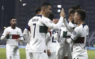 epa10922513 Cristiano Ronaldo (C) and Otavio (R) of Portugal celebrate after scoring the 4-0 lead during the UEFA EURO 2024 group J qualifying soccer match between  Bosnia & Herzegovina and Portugal in Zenica, Bosnia and Hercegovina, 16 October 2023.  EPA/FEHIM DEMIR