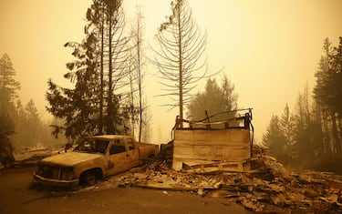 Property and homes razed by a wildfire in Celista, British Columbia, Canada, on Saturday, Aug. 19, 2023. Record-breaking wildfires in Canada, which have already scorched an area larger than Greece, are heading toward key population centers, forcing tens of thousands to evacuate. Photographer: Cole Burston/Bloomberg via Getty Images