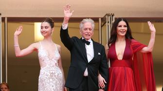 CANNES, FRANCE - MAY 16: (L-R) Carys Zeta Douglas, Michael Douglas and Catherine Zeta-Jones attend the "Jeanne du Barry" Screening & opening ceremony red carpet at the 76th annual Cannes film festival at Palais des Festivals on May 16, 2023 in Cannes, France. (Photo by Daniele Venturelli/WireImage)