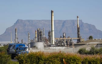 epa05312159 A vehicle passes the Chevron Oil Refinery in Cape Town, South Africa, 17 May 2016. According to reports, continued petrol price increases in 2016 have had a ripple effect across commodity prices, inflation and interest rates. The California based US company Chevrons South African unit operates a 110,000 barrel a day refinery in Cape Town.  EPA/NIC BOTHMA