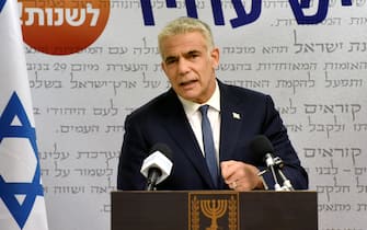 epa09238826 Chairman of the Yesh Atid Party, Yair Lapid, delivers a statement to the press in the Knesset, the Israeli Parliament, in Jerusalem, 31 May 2021. Leader of the Yemina party Bennett on 30 May announced he will form a coalition government with Yair Lapid's Yesh Atid.  EPA/DEBBIE HILL / POOL