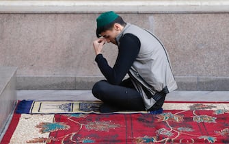 epa11998451 A person prays during the Eid al-Fitr Muslim celebration marking the end of Ramadan, in Bishkek, Kyrgyzstan, 30 March 2025. Muslims around the world celebrate the holy month of Ramadan by praying during the night time and abstaining from eating and drinking during the period between sunrise and sunset. Ramadan is the ninth month in the Islamic calendar and it is believed that the Koran's first verse was revealed during its last 10 nights.  EPA/IGOR KOVALENKO