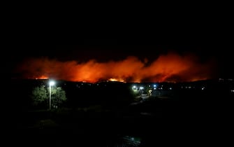 A general view of a wildfire that broke out in an area of farmland and forest in Varnavas, Attica region, Greece, 11 August 2024. The forces working to extinguish the Varnavas fire include 250 firefighters with 10 teams of forest commandos, 67 vehicles and a large number of volunteers, 12 firefighting airplanes and seven helicopters in the air and one helicopter for coordination. Assistance is also being provided by digging machinery and water trucks of the Attica Region and the armed forces. Varnavas residents have been instructed to evacuate the area via a message from the 112 emergency number. ANSA/ALEXANDROS BELTES