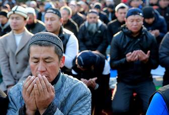 epa10583393 Kyrgyz people pray during the Eid al-Fitr Muslim celebration, marking the end of Ramadan, in Bishkek, Kyrgyzstan, 21 April 2023. Muslims around the world celebrate the holy month of Ramadan by praying during the night time and abstaining from eating and drinking during the period between sunrise and sunset. Ramadan is the ninth month in the Islamic calendar and it is believed that the Koran's first verse was revealed during its last 10 nights.  EPA/IGOR KOVALENKO