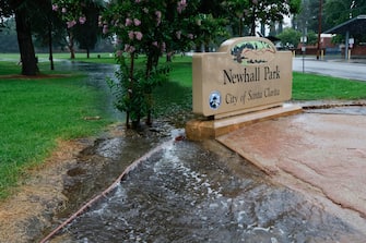 epa10811163 A section of Newhall Park is flooded in Santa Clarita, California, USA, 20 August 2023. Southern California is under a tropical storm warning for the first time in history as Hilary makes landfall. The last time a tropical storm made landfall in Southern California was 15 September 1939, according to the National Weather Service.  EPA/CAROLINE BREHMAN