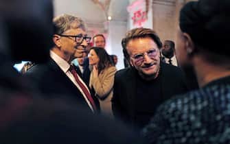 Microsoft founder, Co-Chairman of the Bill & Melinda Gates Foundation, Bill Gates (L) and Irish rock band U2 singer Bono arrive at Lyon's city hall, central eastern France, on October 9, 2019, during the funding conference of Global Fund to Fight AIDS, Tuberculosis and Malaria. The Global Fund to Fight AIDS, Tuberculosis and Malaria on October 9, 2019, opened a drive to raise $14 billion to fight a global epidemics but face an uphill battle in the face of donor fatigue. The fund has asked for $14 billion, an amount it says would help save 16 million lives, avert "234 million infections" and place the world back on track to meet the UN objective of ending the epidemics of HIV/AIDS, tuberculosis and malaria within 10 years. (Photo by Olivier CHASSIGNOLE / POOL / AFP)