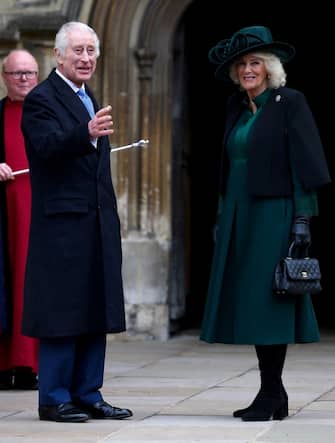 Britain's King Charles III (C) and Britain's Queen Camilla (R) arrive at St. George's Chapel, Windsor Castle, to attend the Easter Mattins Service, on March 31, 2024. (Photo by Hollie Adams / POOL / AFP)
