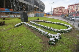 NAPLES, ITALY - 2021/11/25: The statue of Diego Armando Maradona, by the sculptor Domenico Sepe, in front of the Diego Armando Maradona stadium. (Photo by Marco Cantile/LightRocket via Getty Images)