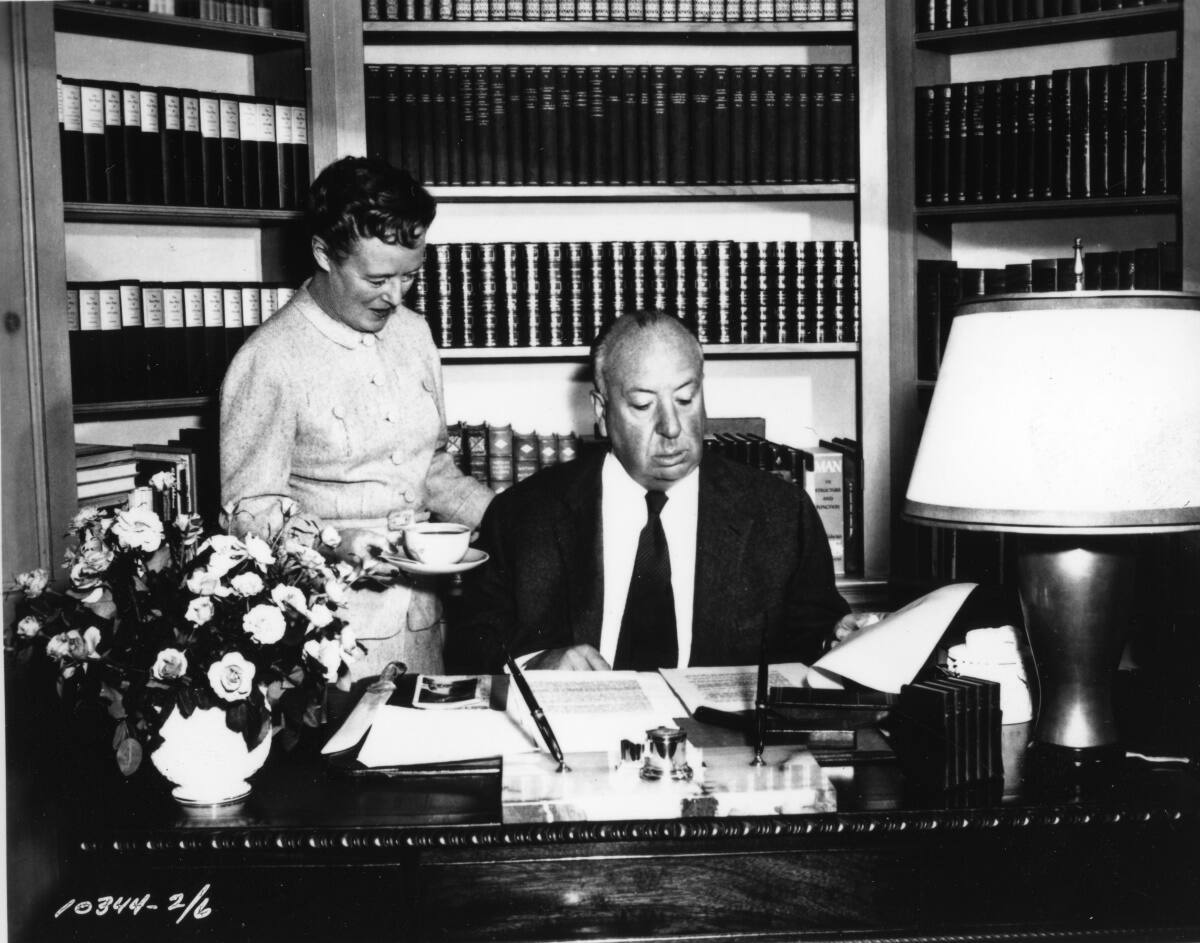HITCHCOCK-PHOTO_Alma_Hitchcock_and_Alfred_at_the_studio_officeCBISON-ARCHIVES.jpg