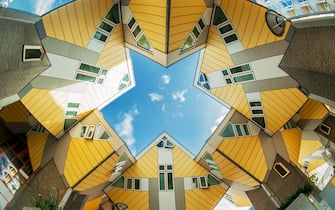 Rotterdam, The Netherlands - October 23, 2013:  Cube houses are a set of innovative houses built in Rotterdam and Helmond in the Netherlands, designed by architect Piet Blom and based on the concept of "living as an urban roof": high density housing with sufficient space on the ground level
