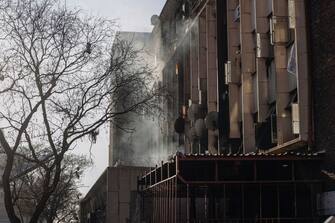 Smoke billows out of a building at the scene of a fire in Johannesburg on August 31, 2023. At least 20 people have died and more than 40 were injured in a fire that engulfed a five-storey building in central Johannesburg on August 31, 2023, the South African city's emergency services said. (Photo by Michele Spatari / AFP) (Photo by MICHELE SPATARI/AFP via Getty Images)