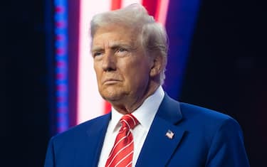 PHOENIX, ARIZONA - DECEMBER 22: U.S. President-elect Donald Trump looks on during Turning Point USA's AmericaFest at the Phoenix Convention Center on December 22, 2024 in Phoenix, Arizona. The annual four day conference geared toward energizing and connecting conservative youth hosts some of the country's leading conservative politicians and activists. (Photo by Rebecca Noble/Getty Images)