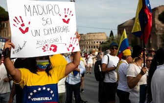 Demonstrators protest the re-election of Venezuelan President Nicolas Maduro during the global demonstration to claim the "truth of victory" in support of Edmundo Gonzalez Urrutia as president-elect in Venezuela's July 28 presidential election, in Rome, Italy, 17 August 2024. ANSA/ANGELO CARCONI