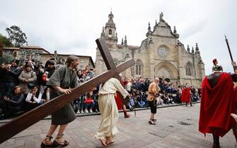 epa11249282 People dressed as Jesus Christ (C) and Roman soldiers re-enact  the Stations of the Cross (Via Crucis) on Good Friday in Balmaseda, Spain, 29 March 2024. Although some writers state that this event dates back to 1480, when a plague epidemic devastated the town, there are no documents confirming its existence until 1771, when the  Holy Week and Corpus Christi Processions  are mentioned in municipal documents for the first time.  Christians of the Catholic and Western Christian churches around the world on 29 March 2024 observe Good Friday, the day when, according to the Bible, Jesus Christ was crucified by the Romans in Jerusalem.  EPA/Luis Tejido