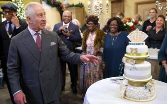 TETBURY, ENGLAND - NOVEMBER 13: King Charles III poses with his cake as he attends his 75th birthday party hosted by the Prince's Foundation at Highgrove House on November 13, 2023 in Tetbury, England. Guests include local residents who have been nominated by friends and family and individuals and organisations also turning 75 in 2023. (Photo by Chris Jackson/Getty Images)