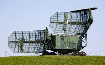 Soviet and russian military radar station with antenna. Air defense. Modern army industry.