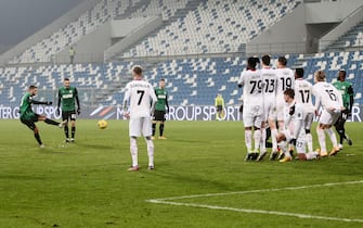 Sassuolo's Domenico Berardi (L) scores the 1-2 goal during the Italian Serie A soccer match US Sassuolo vs AC Milan at Mapei Stadium in Reggio Emilia, Italy, 20 December 2020. ANSA /SERENA CAMPANINI