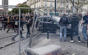 A  police car forces a barricade during a demonstration after the French government pushed a pensions reform through parliament without a vote, using the article 49.3 of the constitution, in Nantes, western France, on March 18, 2023. The French president on March 16 rammed a controversial pension reform through parliament without a vote, deploying a rarely used constitutional power that risks inflaming protests. The move was an admission that his government lacked a majority in the National Assembly to pass the legislation to raise the retirement age from 62 to 64.//SALOM-GOMIS_n016/Credit:Sebastien SALOM-GOMIS/SIPA/2303182021