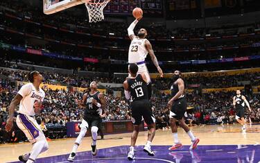 LOS ANGELES, CA - JANUARY 7: LeBron James #23 of the Los Angeles Lakers dunks the ball during the game against the LA Clippers on January 7, 2024 at Crypto.Com Arena in Los Angeles, California. NOTE TO USER: User expressly acknowledges and agrees that, by downloading and/or using this Photograph, user is consenting to the terms and conditions of the Getty Images License Agreement. Mandatory Copyright Notice: Copyright 2024 NBAE (Photo by Andrew D. Bernstein/NBAE via Getty Images) 
