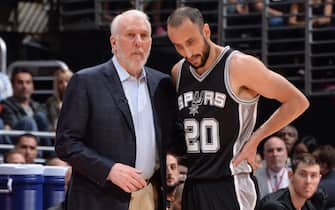 LOS ANGELES, CA - APRIL 28:  Head Coach Gregg Popovich of the San Antonio Spurs talks to Manu Ginobili #20 of the San Antonio Spurs against the Los Angeles Clippers in Game Five of the Western Conference Quarterfinals during the 2015 NBA Playoffs on April 28, 2015 at Staples Center in Los Angeles, California. NOTE TO USER: User expressly acknowledges and agrees that, by downloading and or using this Photograph, user is consenting to the terms and conditions of the Getty Images License Agreement. Mandatory Copyright Notice: Copyright 2015 NBAE (Photo by Andrew D. Bernstein/NBAE via Getty Images)