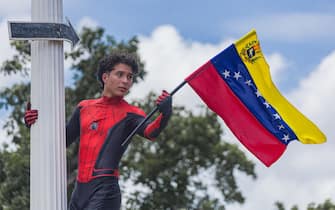 epa11553353 A person dressed as Spiderman waves a flag during a protest against the official results of the country's 28 July presidential elections in Maracaibo, Venezuela, 17 August 2024. The Venezuelan National Electoral Council (CNE) ratified the victory of Nicolas Maduro in Venezuela's presidential elections held on 28 July 2024, while the opposition have been protesting against the official results claiming the victory of Edmundo Gonzalez Urrutia.  EPA/HENRY CHIRINOS