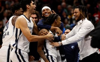 NEW ORLEANS, LOUISIANA - DECEMBER 19: Ja Morant #12 of the Memphis Grizzlies reacts with his team after defeating the New Orleans Pelicans at Smoothie King Center on December 19, 2023 in New Orleans, Louisiana.  NOTE TO USER: User expressly acknowledges and agrees that, by downloading and or using this photograph, User is consenting to the terms and conditions of the Getty Images License Agreement. (Photo by Chris Graythen/Getty Images)