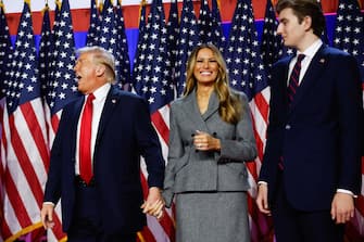 WEST PALM BEACH, FLORIDA - NOVEMBER 06: Republican presidential nominee, former U.S. President Donald Trump reacts on stage with former first lady Melania Trump during an election night event at the Palm Beach Convention Center on November 06, 2024 in West Palm Beach, Florida. Americans cast their ballots today in the presidential race between Republican nominee former President Donald Trump and Vice President Kamala Harris, as well as multiple state elections that will determine the balance of power in Congress.   Chip Somodevilla/Getty Images/AFP (Photo by CHIP SOMODEVILLA / GETTY IMAGES NORTH AMERICA / Getty Images via AFP)