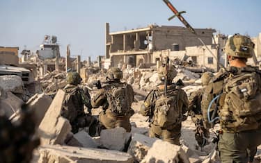 This handout picture released by the Israeli army on October 18, 2024, shows troops on the ground in the Rafah area in the southern Gaza Strip, amid the continuing war between Israel and the Palestinian militant group Hamas. (Photo by Israeli Army / AFP) / === RESTRICTED TO EDITORIAL USE - MANDATORY CREDIT "AFP PHOTO / Handout / Israeli Army' - NO MARKETING NO ADVERTISING CAMPAIGNS - DISTRIBUTED AS A SERVICE TO CLIENTS ==
