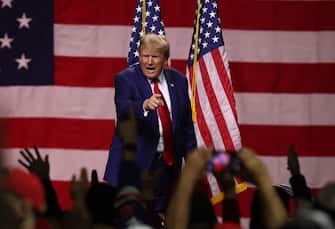 RENO, NEVADA - DECEMBER 17: Republican Presidential candidate former U.S. President Donald Trump delivers remarks during a campaign rally at the Reno-Sparks Convention Center on December 17, 2023 in Reno, Nevada. Former U.S. President Trump held a campaign rally as he battles to become the Republican Presidential nominee for the 2024 Presidential election.  (Photo by Justin Sullivan/Getty Images)