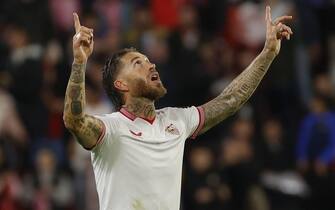 epa11001798 Sevilla's defender Sergio Ramos celebrates after scoring the 1-0 goal during the UEFA Champions League group B soccer match between Sevilla FC and PSV Eindhoven, in Seville, Andalusia, Spain, 29 November 2023.  EPA/Julio Munoz