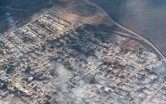 epa10792529 An arial view of buildings damaged in Lahaina, Hawaii as a result of a large wildfire which has killed 6 people and forced thousands of evacuations on the island of Maui in Hawaii, USA, 09 August 2023. Winds from Hurricane Dora, which is currently over the Pacific Ocean hundreds of miles south of Hawaii, have intensified the wildfires.  EPA/CARTER BARTO