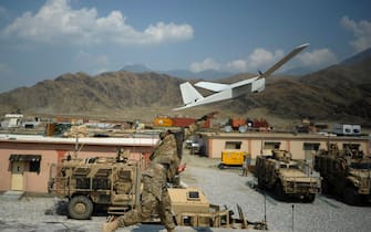 Liutenant David Mc Curdy of the Baker Comapny 2-12 infantry of the US Army launches a Puma Dorin airplane at the Forward Operating Base Joyce in the Kunar province on August 20, 2012.  NATO has some 130,000 troops in Afghanistan who are due to pull out in 2014 and are spending increasing amounts of time working alongside and training Afghan forces who will take over when they leave.  AFP PHOTO/ Jose CABEZAS (Photo by Jose CABEZAS / AFP) (Photo by JOSE CABEZAS/AFP via Getty Images)