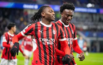 AC Milan's English forward #90 Tammy Abraham and AC Milan's Portuguese forward #10 Rafael Leao celebrate a goal during the UEFA Champions League football match SK Slovan Bratislava vs AC Milan in Bratislava, Slovakia on November 26, 2024. (Photo by -STR / AFP)