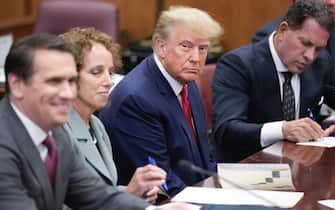 NEW YORK, NEW YORK - APRIL 04: Flanked by attorneys, former U.S. President Donald Trump appears in the courtroom for his arraignment proceeding at Manhattan Criminal Court on April 4, 2023, in New York City. Trump was arraigned during his first court appearance today following an indictment by a grand jury that heard evidence about money paid to adult film star Stormy Daniels before the 2016 presidential election. With the indictment, Trump becomes the first former U.S. president in history to be charged with a criminal offense. (Photo by Seth Wenig-Pool/Getty Images)
