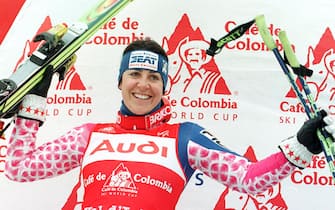 Italian Deborah Campagnoni celebrates on the podium of the the World Cup giant slalom 19 December in Val d'Isere. Compagnoni won her eighth straight World Cup giant slalom. Austrian Alexandra Meissnitzer was second, and and French Leila Piccard, third.   EPA/AFP/PASCAL PAVANI