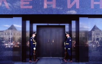 Two Russian guards of identical height stand at the entrance to Lenin’s Tomb on Red Square.