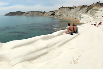 PORTO EMPEDOCLE,SICILY,ITALY - JUNE 6: A view of Scala Dei Turchi (Stair of the Turks) on June 06, 2018 in Scala Dei Turchi near Porto Empedocle,  Italy.  The Scala Dei Turchi is a rocky cliff on the coast of Realmonte in Sicily, Italy. Between two sandy beaches, and is accessed through a limestone rock formation in the shape of a staircase. The Scala is formed by marl, a white coloured sedimentary rock.  (Photo by Franco Origlia/Getty Images)