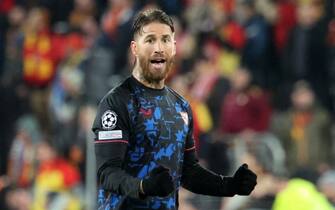 Sevilla's Spanish defender #04 Sergio Ramos reacts after scoring his team's first goal during the Champions League football match between RC Lens and Sevilla at the Stade Bollaert-Delelis in Lens, northern France, on December 12, 2023. (Photo by FRANCOIS LO PRESTI / AFP)