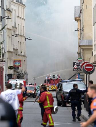 French firefighters put out a fire after a building partly collapsed at Place Alphonse-Laveran in the 5th arrondissement of Paris, on June 21, 2023. A major fire broke out on June 21, 2023 in a building in central Paris, part of which collapsed, according to images taken by AFP journalists. (Photo by Alain JOCARD / AFP) (Photo by ALAIN JOCARD/AFP via Getty Images)