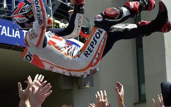 Spanish rider Marc Marquez of Honda Repsol team celebrates his victory after the MotoGP race of the Grand Prix of Italy, at the Mugello circuit, Scarperia, central Italy, 01 June 2014  ANSA/ CLAUDIO ONORATI
